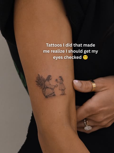 Small microrealism tattoo of an adult and child sharing a flower